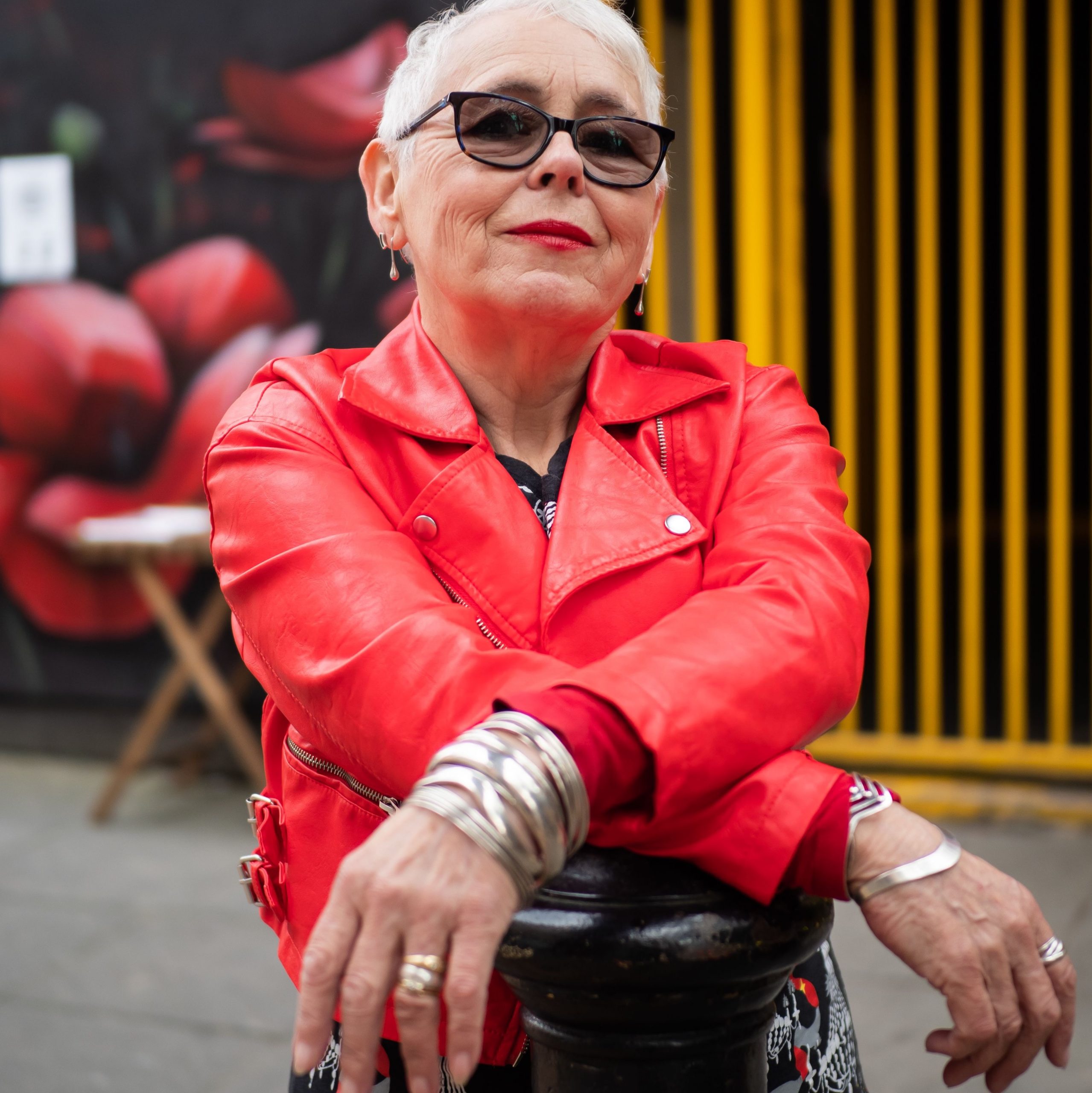 older woman in red leather jacket with no regrets